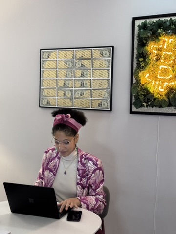 Someone working on a laptop at Coffice