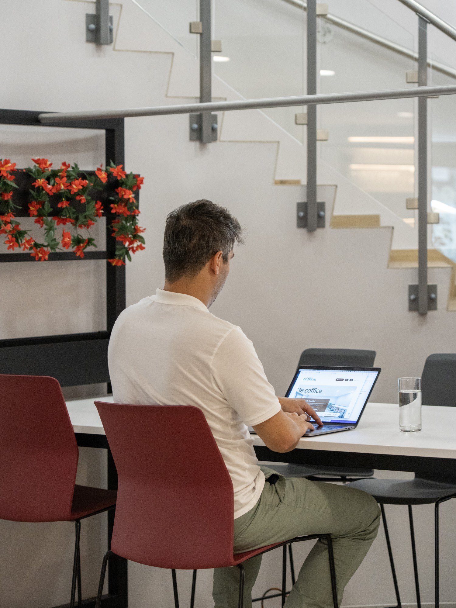 Someone working at Coffice, the upper floor behind